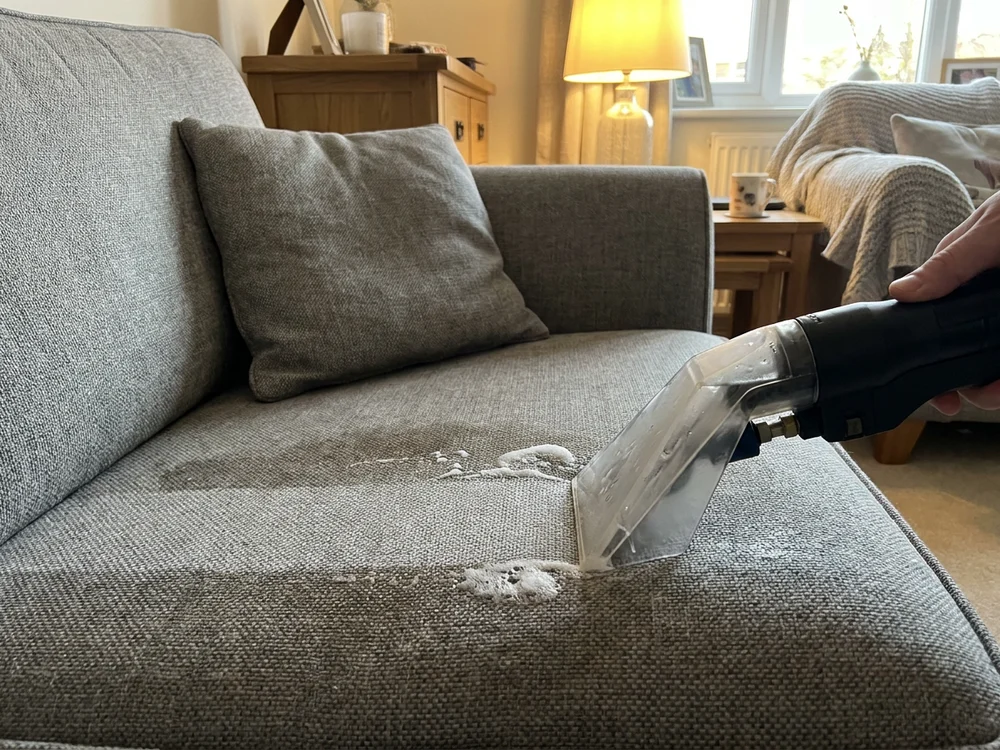 Fabric sofa being cleaned in a Repton home